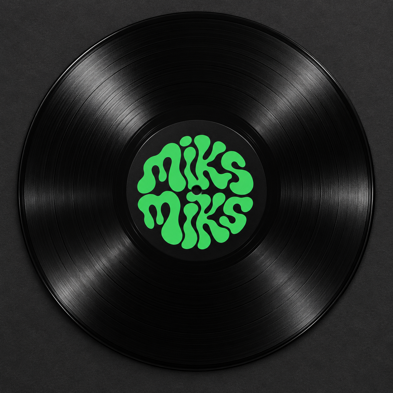 Black vinyl record with the green circular miksmiks label